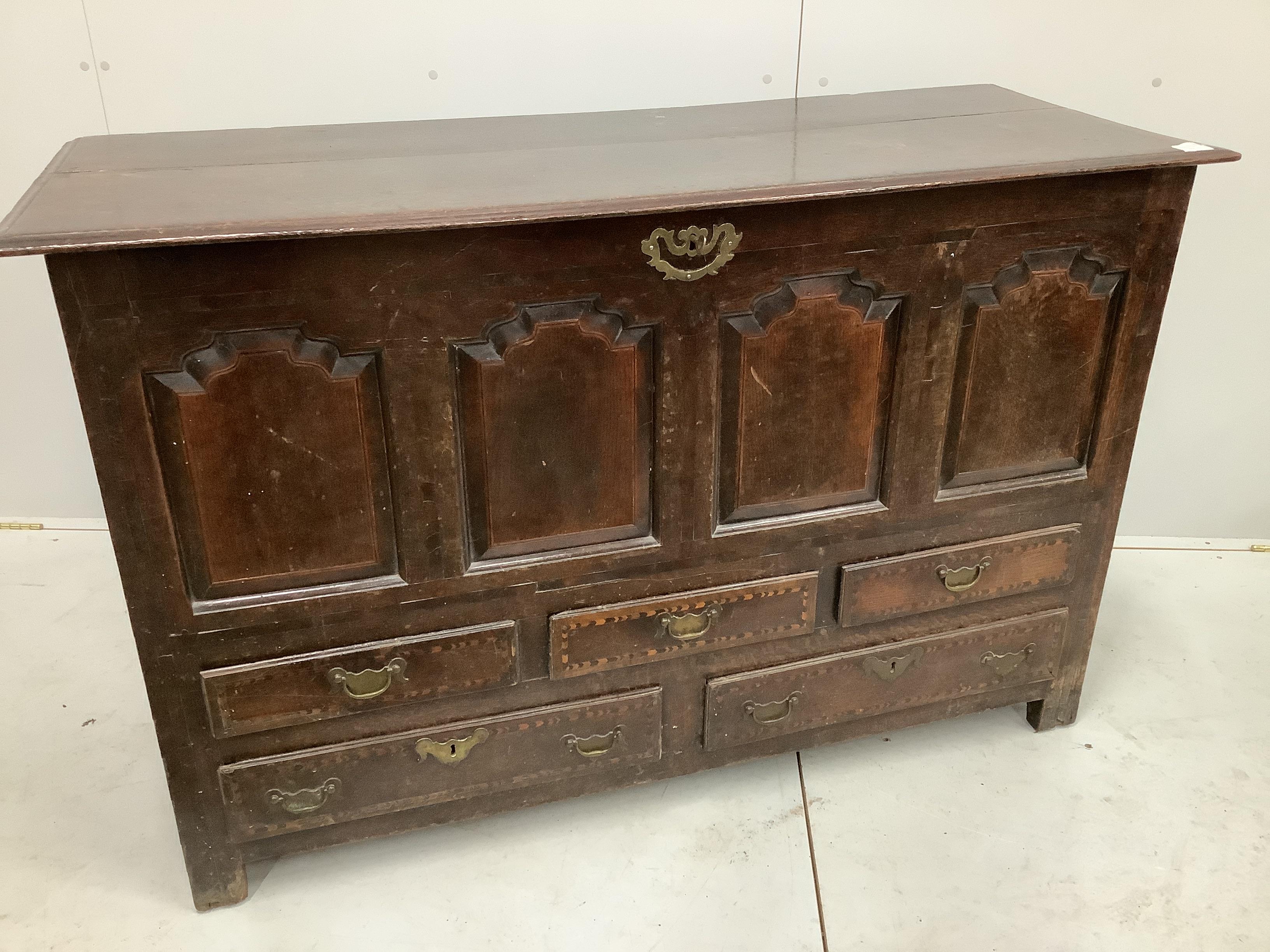 An 18th century oak mule chest, width 140cm, depth 56cm, height 90cm